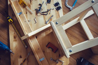 DIY concepts with wood furniture and tool and another equipment.assembly,improvement or repairing home interior.top view