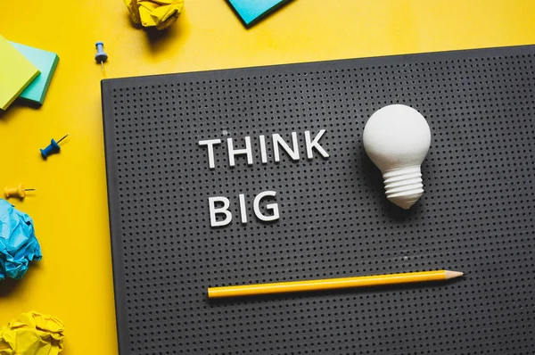 Think Big Text Lightbulb Desk Worktable Background Creativity Inspiration Concepts — Stockfoto