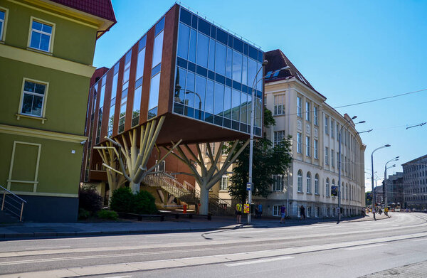 TALLINN, ESTONIA - JULY 21, 2014: Modern architecture (a building on stilts) in the street of historical center of Tallinn, Estonia