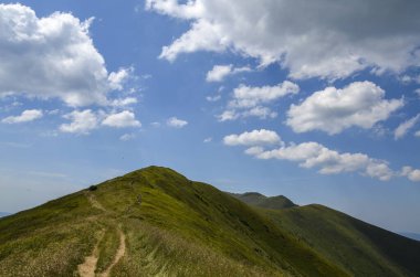 Beautiful view to Borzhava ridge with green meadows on the mountains. Carpathian mountains, Ukraine