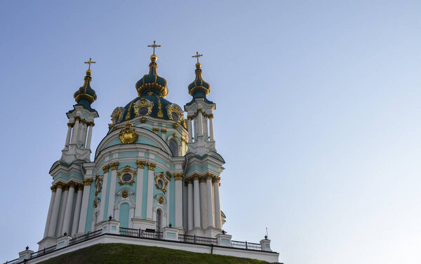 Low angle view of Saint Andrew's Church in the baroque style against blue sky in the city of Kyiv capital of Ukraine