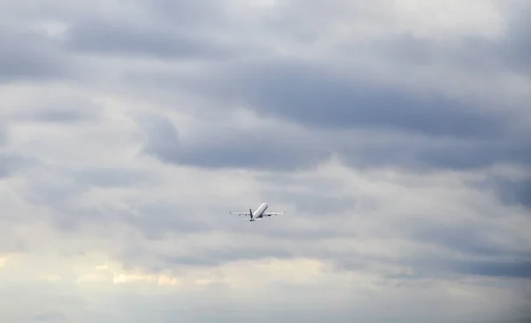 Passenger Airplane Cloudy Sky Flying Away Travel Concept — Fotografia de Stock