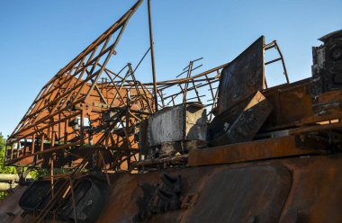 Close up of destroyed military equipment of the russian invaders. Rusty detail of a burnt combat vehicle. War in Ukraine
