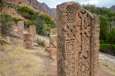 Several ancient carved Cross stones known as Khachkars at the Noravank Monastery in Armenia.