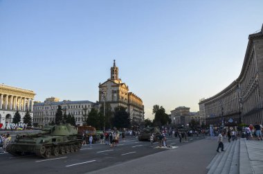 People walk along Khreshchatyk street in Kyiv during an exhibition of russian military equipment destroyed by Ukrainian forces