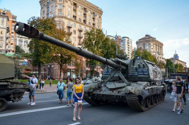 People explore the exhibition of destroyed russian military equipment in Kyiv, Ukraine