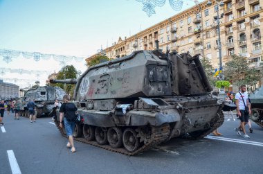 People visit an exhibition of destroyed Russian military vehicles and weapons in Kyiv