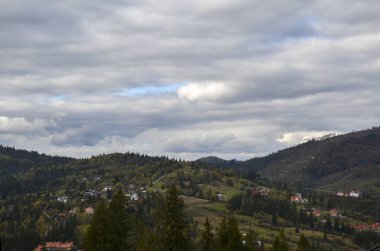 Top view of Carpathian Mountains and village Slavske in autumn season in Ukraine
