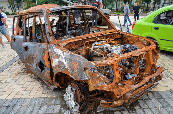A burnt-out car destroyed as a result of shelling by Russian invaders. War in Ukraine