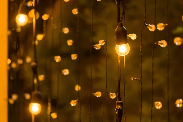 The light bulb ball hanging on electric wire