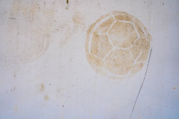 Football print on cement background,soccer slough on wall