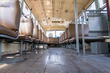 Bangkok, Thailand - May, 29, 2022 : Empty leather seat inside the vintage auto bus of bangkok metropolis, thailand transportation