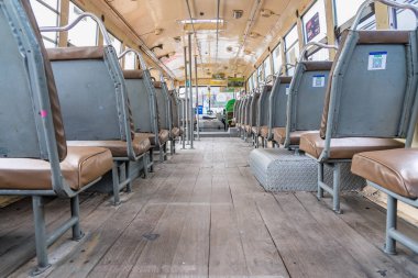 Bangkok, Thailand - May, 29, 2022 : Empty leather seat inside the vintage auto bus of bangkok metropolis, thailand transportation