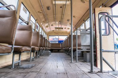 Bangkok, Thailand - May, 29, 2022 : Empty leather seat inside the vintage auto bus of bangkok metropolis, thailand transportation