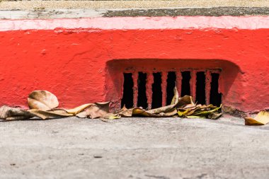 drainage system with rusty iron grating stormwater system road