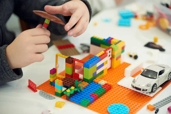 Hands Child Who Plays Plastic Colored Children Constructor — Fotografia de Stock