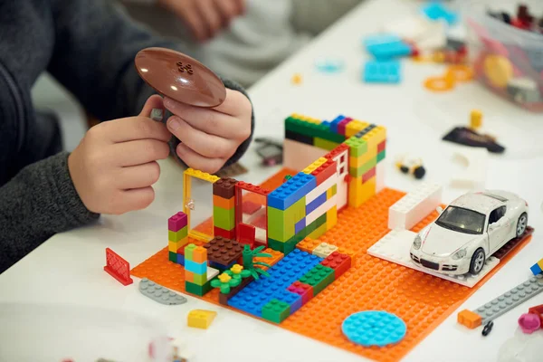 Hands Child Who Plays Plastic Colored Children Constructor — Stock Photo, Image