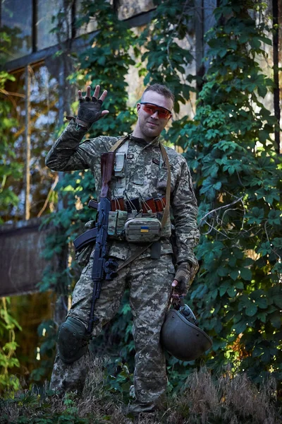 Soldier of the Ukrainian army in military uniforms in the forest