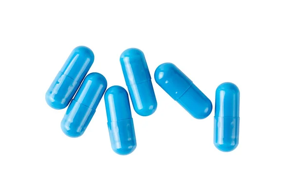 Antibiotika na bílém pozadí. Modré pilulky. Izolovat pilulky na bílém. — Stock fotografie