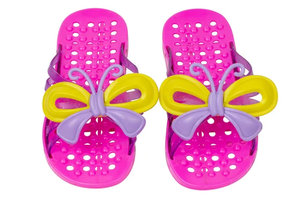 Beyaz arka planda çocuk terlikleri. Pembe terlikler..