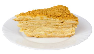 A slice of cake on a plate. Isolate on a white background. Layer cake.