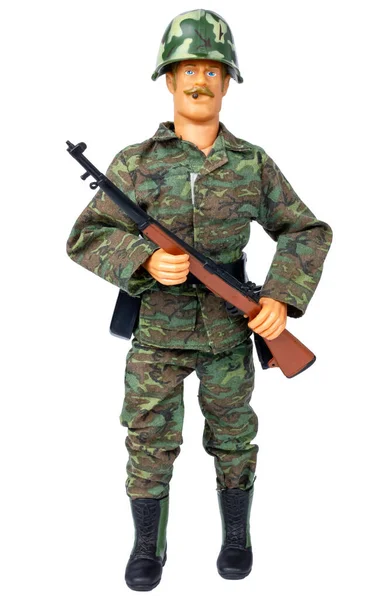 Plastic model of a soldier. Toy soldier. Isolate on a white background. Male doll in camouflage clothing. — стоковое фото