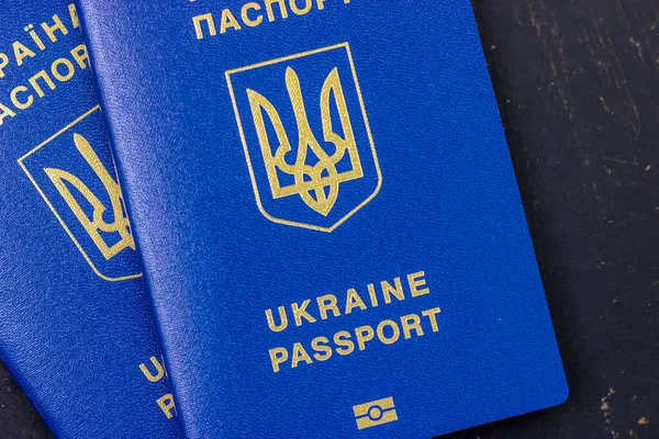 Ukrainian biometric passport on a dark background. — Foto de Stock