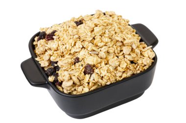 Müsli beyaz arka planda bir kasede izole edilmiş. Müsli izole edildi. Yüksek kalite fotoğraf