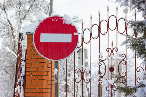 Snow covered road sign. Road sign no entry. Road traffic warning. High quality photo