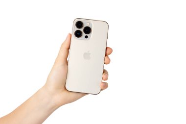 UKRAINE, DNEPR - JULY 14, 2022: smartphone Apple Iphone 13 Pro. A hand holds an iPhone 13 pro on a white background. Iphone 13 pro back view isolated on white. High quality photo