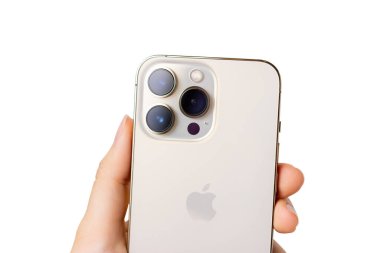 UKRAINE, DNEPR - JULY 14, 2022: smartphone Apple Iphone 13 Pro. A hand holds an iPhone 13 pro on a white background. Iphone 13 pro back view isolated on white. High quality photo