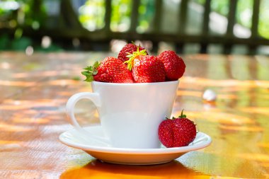 Harvested strawberries on a table in the garden. Harvest strawberries. High quality photo