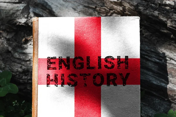 A book about the history of England. A book with a cover in the colors of the English flag. High quality photo