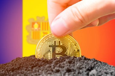 Legalization of bitcoins in Andor. Planting a Bitcoin in the ground against the background of the Andoran flag. Andora - investment in cryptocurrency. . High quality photo