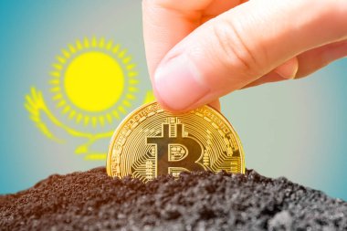 Legalization of bitcoins in Kazakhstan. Planting Bitcoin in the ground against the background of the flag of Kazakhstan. Kazakhstan - investment in cryptocurrency. High quality photo