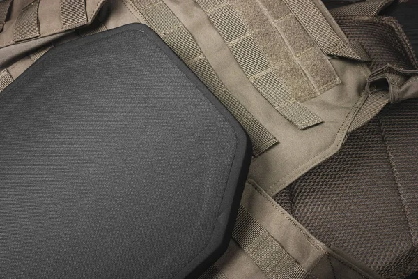 Ballistic insert for body armor. Armored insert for a bulletproof vest. Body armor close-up. High quality photo