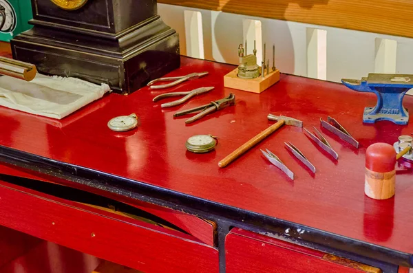 Antique red work table with tools