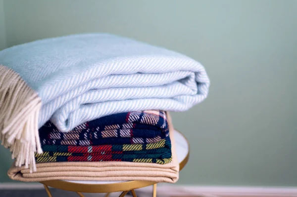 Stack of woolen checked blankets — Stock Photo, Image