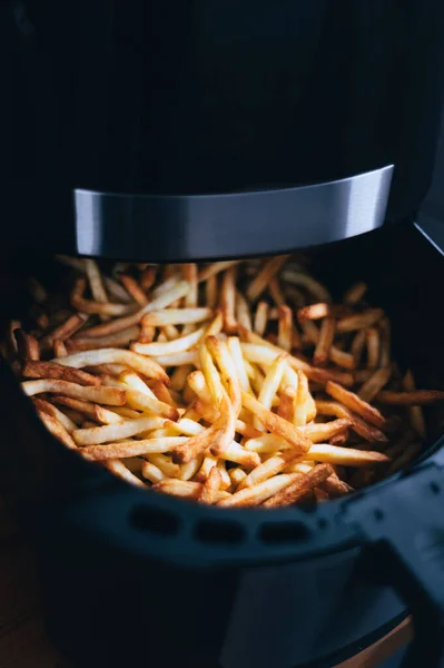 Air fryer with french fries on the worktop — Stock Photo, Image