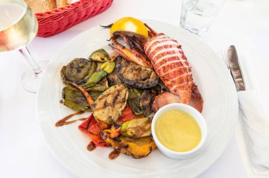 Grilled vegetables and squid, calamari served in Greek tavern, traditional greece food