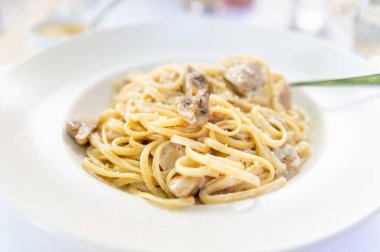 Creamy mushroom Spaghetti pasta, Vegan option, served in restaurant