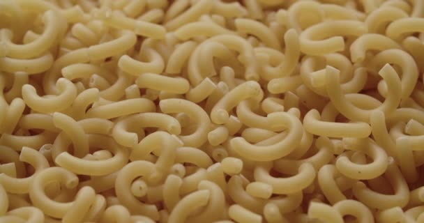 Macaroni Pieces Being Added To Heap Of Dried Pasta — Stock Video