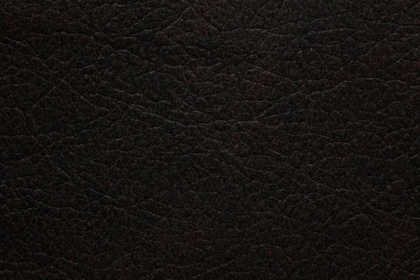 Αποτελεσματικό σκούρο δερμάτινο φόντο. Άριστη σκούρα δερματική υφή. — Φωτογραφία Αρχείου