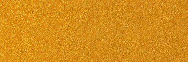 Shiny glitter texture, your Christmas wallpaper in excellent gold tone. High resolution photo.