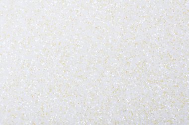 Light holographic glitter background in classic light color as part of your new design. High resolution photo.