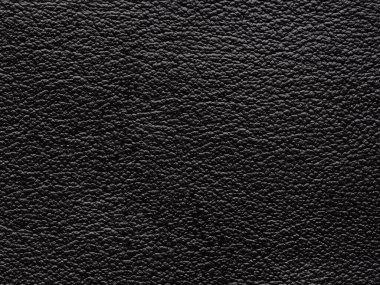 Siyah deri ürünün desenli yüzeyi. Duvar kağıdı ya da lüks bir etkinlik olarak kullanılabilir. Tasarım giysileri, el çantaları, kemerler için kullanılır. PVC tabanında dalgalar ve kıvrımlar olan siyah yapay deri..