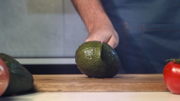 Chef Cuts Avocado Slow Motion Slice Avocado Close Falling Avocado — Stock Video