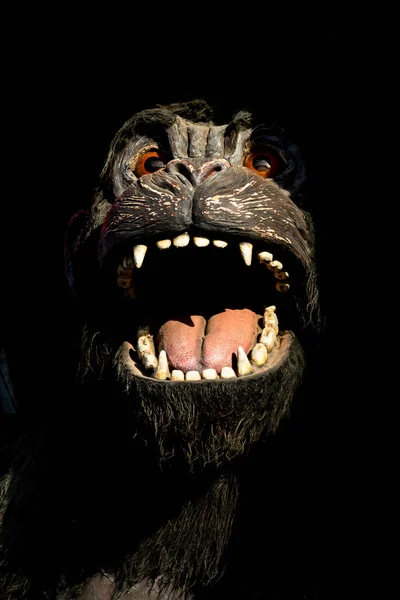 Gorilla monster. Scary and angry gorilla with big jaws and evil eyes. Puppets, toys and statues