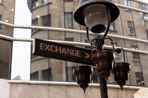 Exchange currency sign in the city. Economy and finance concept