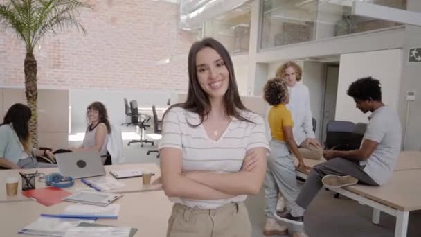 Portrait of successful handsome executive businesswoman smart looking at camera and smiling, arms crossed in modern office workplace. Young Caucasian female casual business — Stock Video